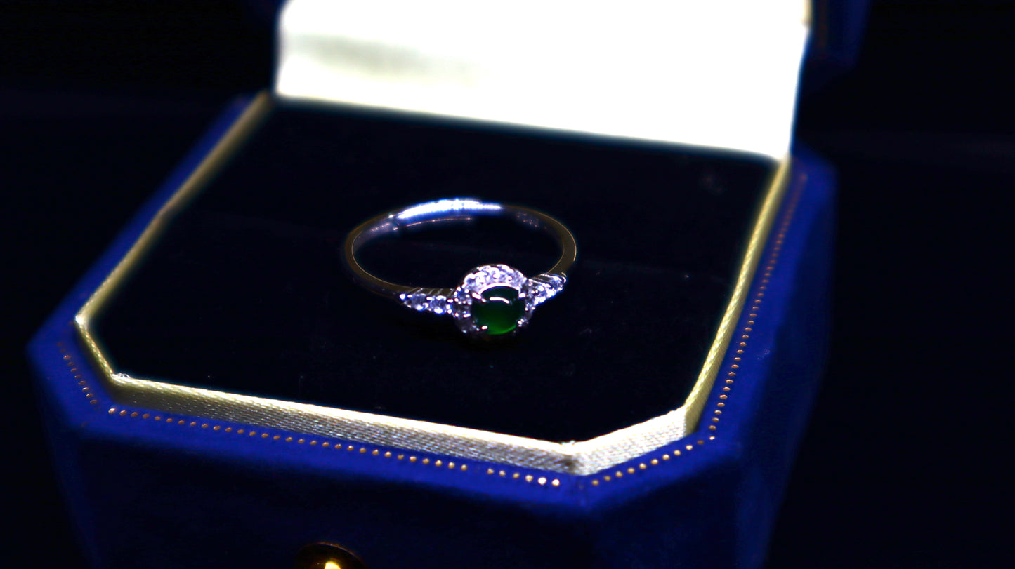 Classic Round Jade Ring with Halo of Sparkling Cubic Zirconia in Sterling Silver